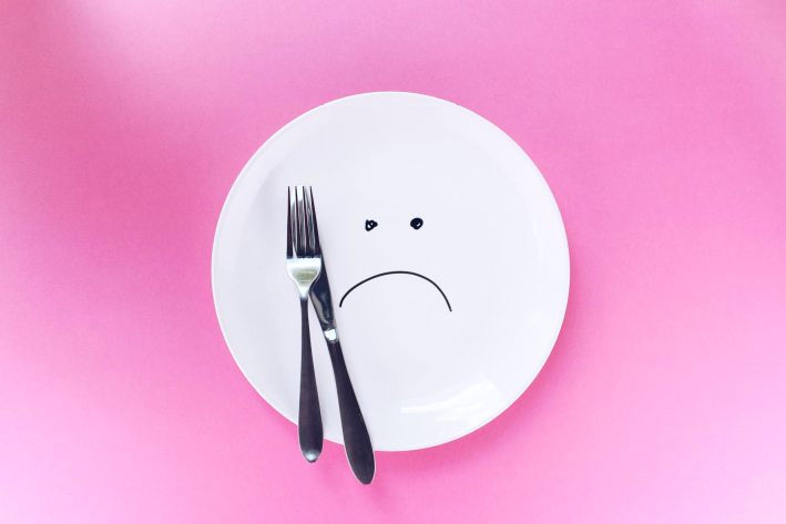 Plate with a frowning face