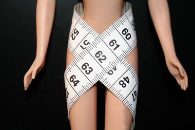tape measure on barbie doll